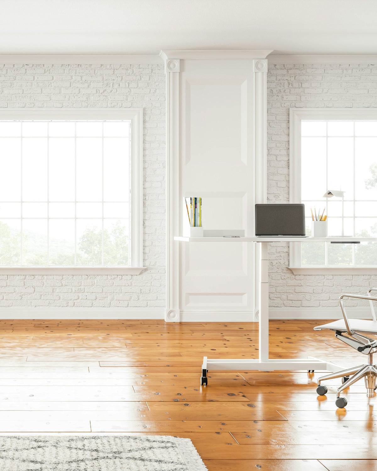 Bright white room with a small standing desk and a mesh office chair on a wooden floor