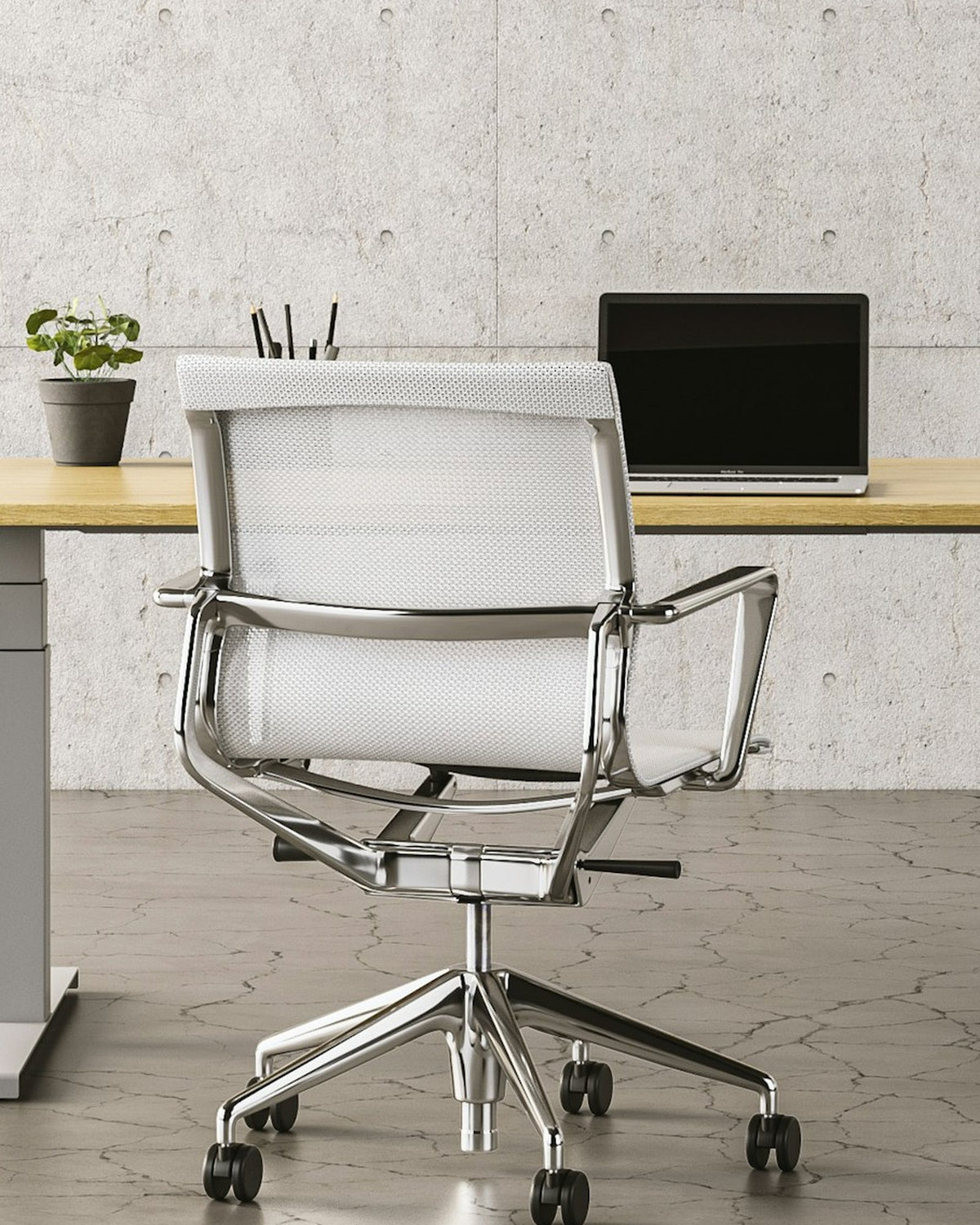 Office with a concrete wall, pendant lamps, a desk and a mesh office chair